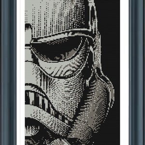 May include: A close-up of a Stormtrooper helmet in black and white. The helmet is made of plastic and has a detailed design. The helmet is a popular collectible for fans of the Star Wars franchise.