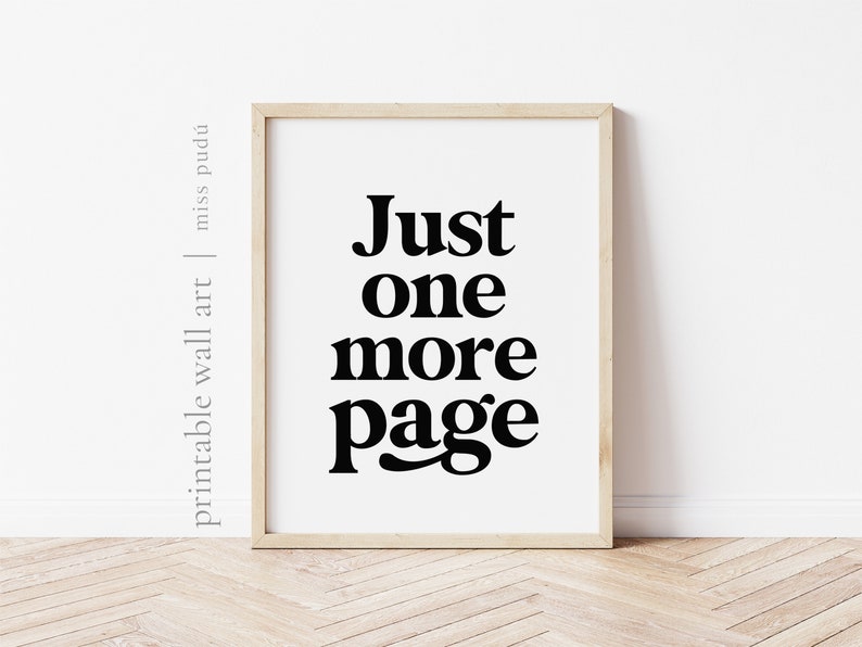 May include: A black and white printable wall art print with the text "Just one more page" in a bold, modern font.
