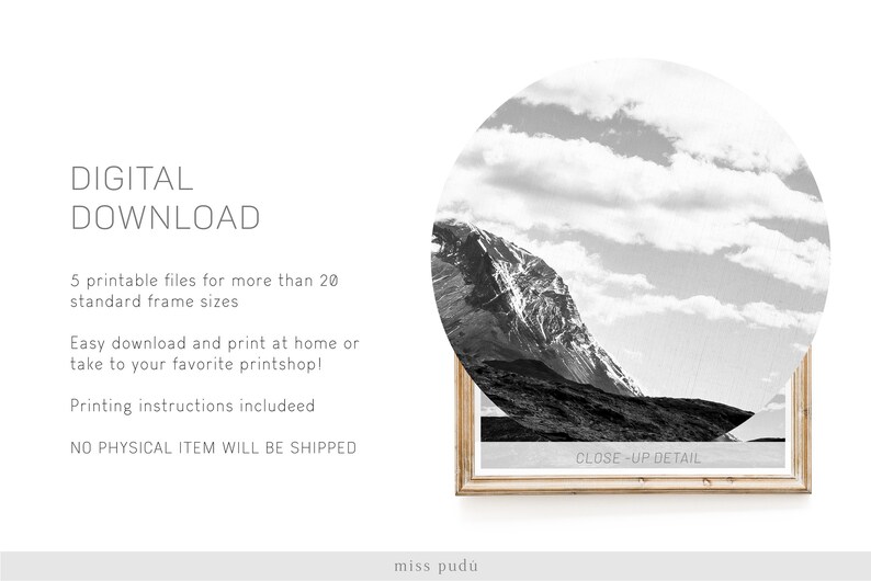 May include: A black and white photograph of a mountain range with a cloudy sky. The image is framed in a light wood frame. The text "CLOSE-UP DETAIL" is printed on the bottom of the frame.