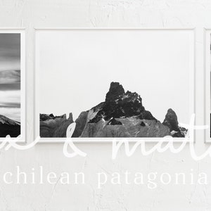 May include: Three black and white photographs of mountains in Chile. The photos are framed in white and are arranged horizontally on a white wall. The text "mix & match - chilean patagonia -" is written below the photos.