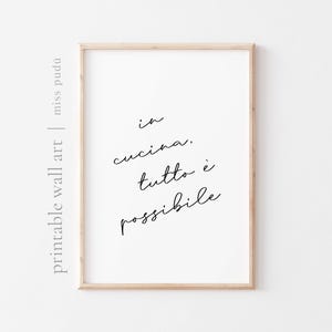 May include: A printable wall art print with the text "in cucina, tutto è possibile" in black cursive script on a white background.