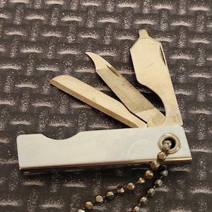 Vintage Liter Folding Keychain Tool Knife Bottle Opener Nail File Made in the USA The H & M Supply Co Advertising