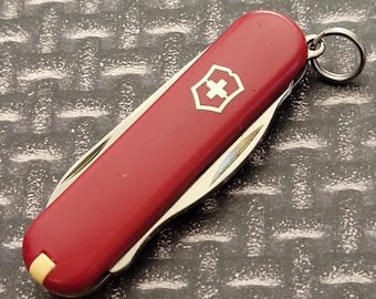 Victorinox Rally Swiss Army Multi Tool Folding Pocket Knife Made In Switzerland 58mm Closed Red Plastic Handles Stainless Blades