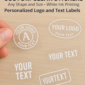 May include: Clear stickers in various shapes, including square, oval, and rectangular. Each sticker features white text, with the words "YOUR LOGO" and "YOUR TEXT" displayed. The stickers are designed for personalized logos and text labels.