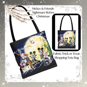 May include: Black fabric tote bag featuring a colorful illustration of Mickey Mouse and friends in a Halloween theme. The bag has black handles and the text "Mickey & Friends Nightmare Before Christmas" and "Fabric Trick or Treat / Shopping Tote Bag".