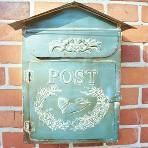 Letterbox made of metal in the country house Shabby chic style, blue-turquoise