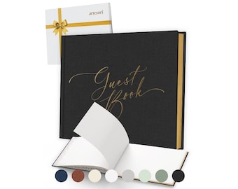 May include: A black guest book with gold lettering that reads "Guest Book". The book is open to reveal blank white pages. A white gift box with a gold ribbon is in the background. A selection of color options are shown at the bottom.