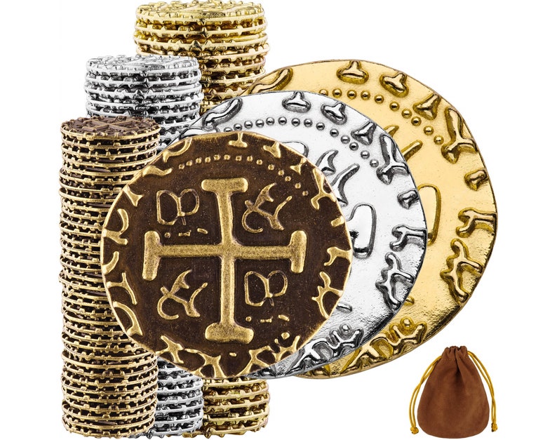 May include: A set of gold and silver coins with a brown leather pouch. The coins have intricate designs and are stacked in a pile.