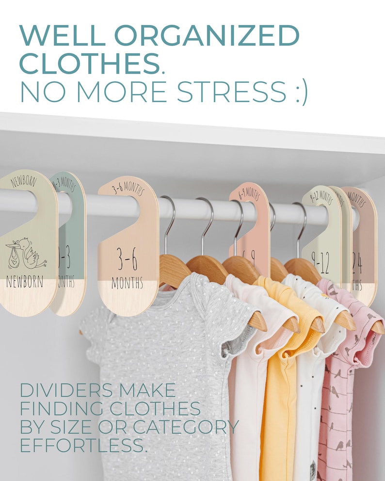 May include: A set of six colorful, wooden closet dividers with hangers for organizing baby clothes. The dividers are labeled with different age ranges: Newborn, 1-3 months, 3-6 months, 6-9 months, 9-12 months, and 12-24 months. The text "DIVIDERS MAKE FINDING CLOTHES BY SIZE OR CATEGORY EFFORTLESS." is printed below the dividers.
