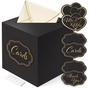 May include: Black card box with a slot for cards and a gold "Cards" label.  The box comes with three black and gold labels that say "Mr. & Mrs.", "Cards", and "Thank You!" and adhesive dots.
