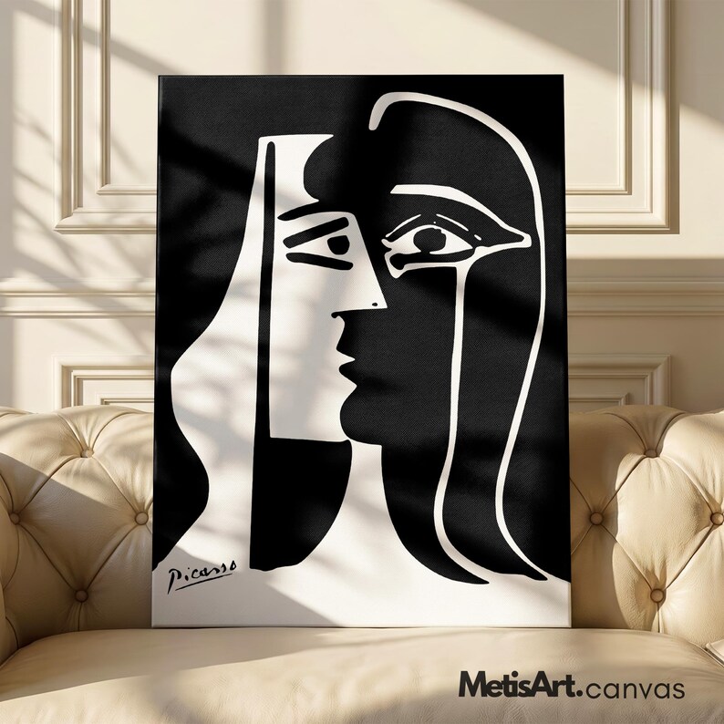 May include: A rectangular canvas print featuring a high-contrast black and white graphic illustration of a stylized face in profile. The artwork displays bold, clean lines and geometric shapes, with the signature Picasso printed in the bottom left corner.