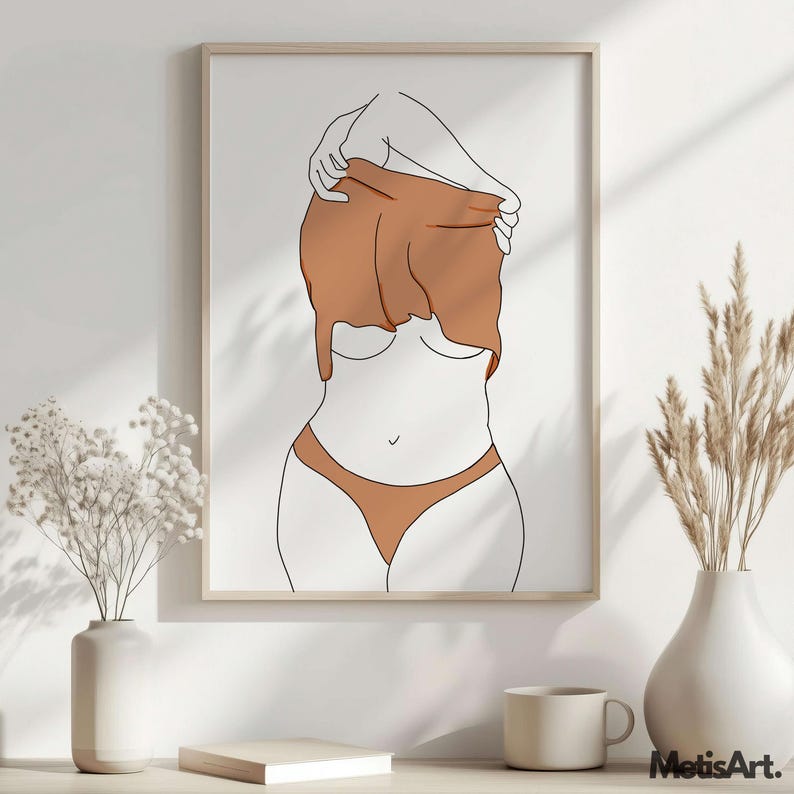 May include: Framed minimalist art print featuring a line drawing of a figure partially undressing. The artwork uses a palette of white, brown, and black. The figure is wearing brown underwear. The print is displayed on a white wall with decorative vases.