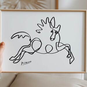 Fine-art giclée print of a leaping horse outlined in abstract contours, signed “Picasso” in the corner.
