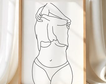 May include: A framed line art print featuring a black outline drawing of a torso on a white background. The figure is shown from the chest down, with arms raised to pull a shirt over the head. The text MetisArt is printed in the bottom right corner.