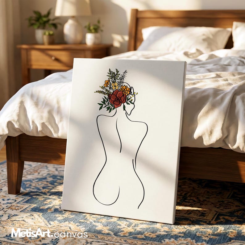 May include: A rectangular canvas print featuring a black line art drawing of a human back. The figure has a cluster of colorful flowers in shades of red, yellow, and green resting on the head area. The background of the canvas is solid white.