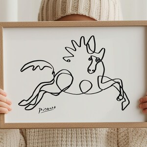 Modern equestrian wall art: Picasso’s interpretation of a jumping horse in expressive, tangled black lines.