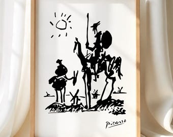 May include: A framed black and white line drawing print featuring a stylized depiction of Don Quixote and Sancho Panza on horseback with a sun and windmills in the background. The artwork includes the signature Picasso in the bottom right corner.