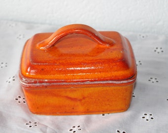 Butter dish made of ceramic orange butter bell from the pottery