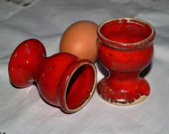 red ceramic egg cup made in pottery