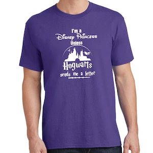 May include: Purple t-shirt with white text that reads "I'm a Disney Princess Unless Hogwarts sends me a letter". The graphic also includes a silhouette of Hogwarts castle.