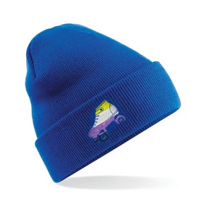 May include: A bright blue beanie hat with a turned-up brim. The hat has an embroidered roller skate design in yellow, white, and purple. The roller skate has black wheels and a black outline.