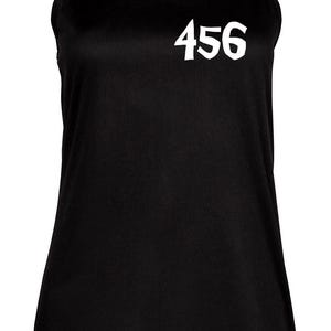 May include: Black sleeveless tank top with the number 456 printed in white on the front.