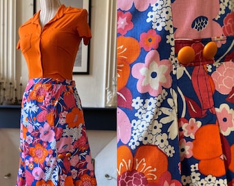 Vintage 70s midi length skirt with floral patterns and flashy colors Size 38/40