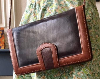 Beautiful two-tone vintage 70s leather bag, gusseted clutch style with braided shoulder strap
