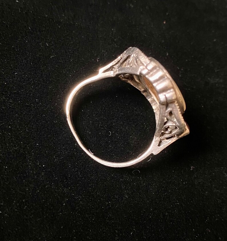 purple stone inlays and large mother-of-pearl set in the centre T 6264 Vintage silver 60s ring with silver oval cabochon