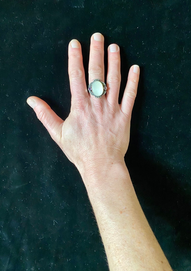 purple stone inlays and large mother-of-pearl set in the centre T 6264 Vintage silver 60s ring with silver oval cabochon