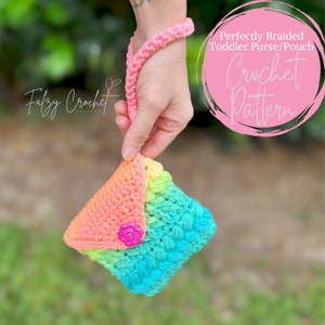 May include: A rainbow crochet toddler purse with a pink handle and a pink button. The purse is held in a hand. The text "Perfectly Braided Toddler Purse/Pouch Crochet Pattern" is in a pink circle.