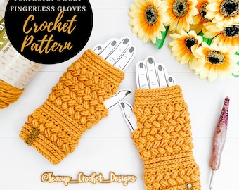 May include: A pair of mustard yellow crochet fingerless gloves with a textured stitch pattern. The gloves are laid out on a white surface with a skein of yarn and a crochet hook. The text "Perfectly Sweet Fingerless Gloves Crochet Pattern" is visible in the image.