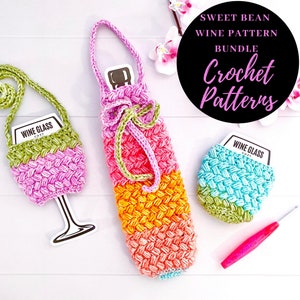 May include: A set of three crochet wine bottle and glass cozies in pink, orange, green, and blue. The cozies are made with a textured stitch and have a 'Wine Glass Cozy' label. The set includes a crochet hook.