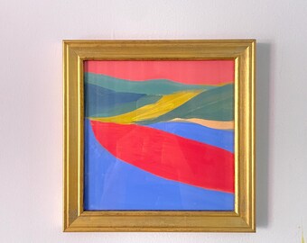 May include: A framed abstract painting with a gold frame. The painting features a landscape with a red, yellow, blue, and green color scheme.