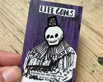 I'm Still Alive Ultimate White and Black  Colour Self Help Mantra Happy Spooky Skull Enamel Pin Badge