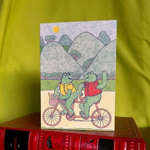 Carte de voeux A6 Grenouilles sur un cycle tandem date Saint-Valentin message A6