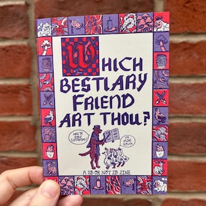 Op de afbeelding: Een rechthoekige zine getiteld "Which Bestiary Friend Art Thou?" heeft een rode en paarse rand met illustraties. De cover heeft een centrale illustratie van een hond die voorleest aan ganzen. Tekst bevat "A 2B or Not 2B Zine."