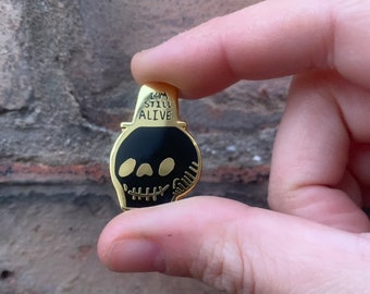 I'm Still Alive Ultimate Black and Gold Colour Self Help Mantra Happy Spooky Skull Enamel Pin Badge