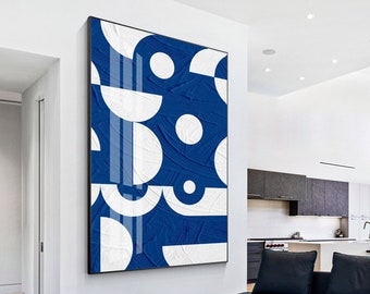 May include: Abstract geometric wall art featuring a blue background with white circles and semi-circles. The artwork has a textured, brushstroke effect.