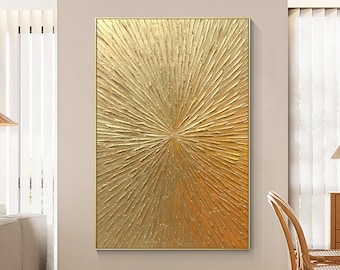 May include: A rectangular wall art piece featuring a thick, textured gold paint application. The surface displays a radial sunburst pattern with raised, impasto-style strokes emanating from the center toward the edges in a metallic gold finish.