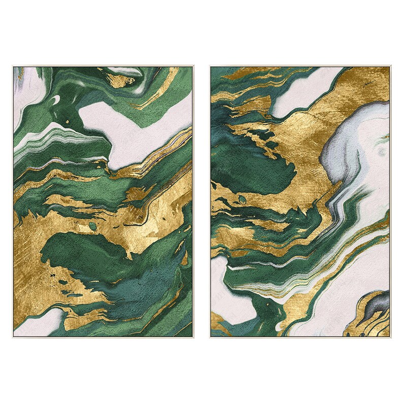 May include: A set of two rectangular wall art panels featuring an abstract marbled pattern. The design consists of flowing, organic layers of deep forest green, crisp white, and metallic gold foil accents, all contained within a thin silver frame.