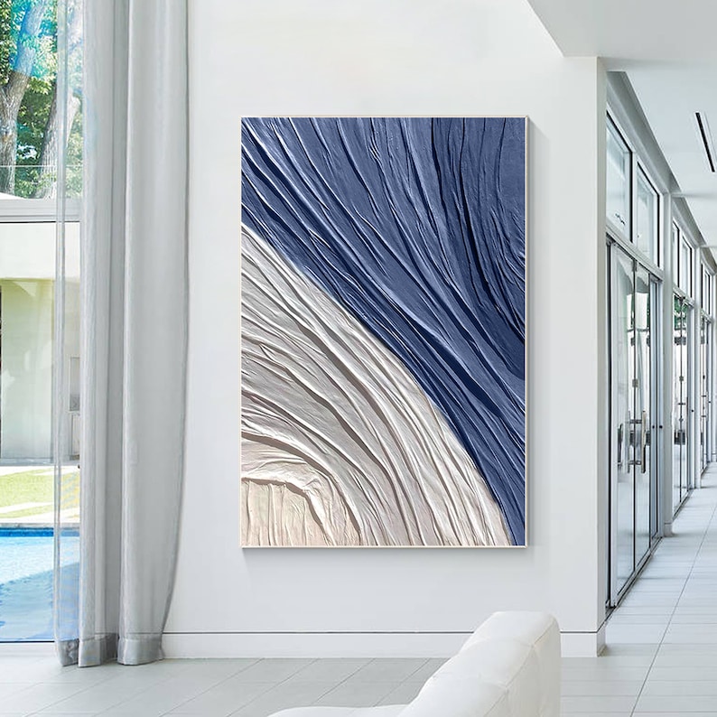 Abstract navy blue wall art with unique 3D texture and cream accents, perfect for bedroom or office