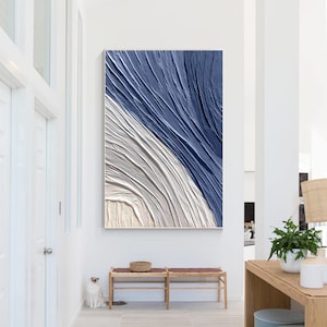 Large blue abstract wall art with textured layers in navy blue and gray tones for living room