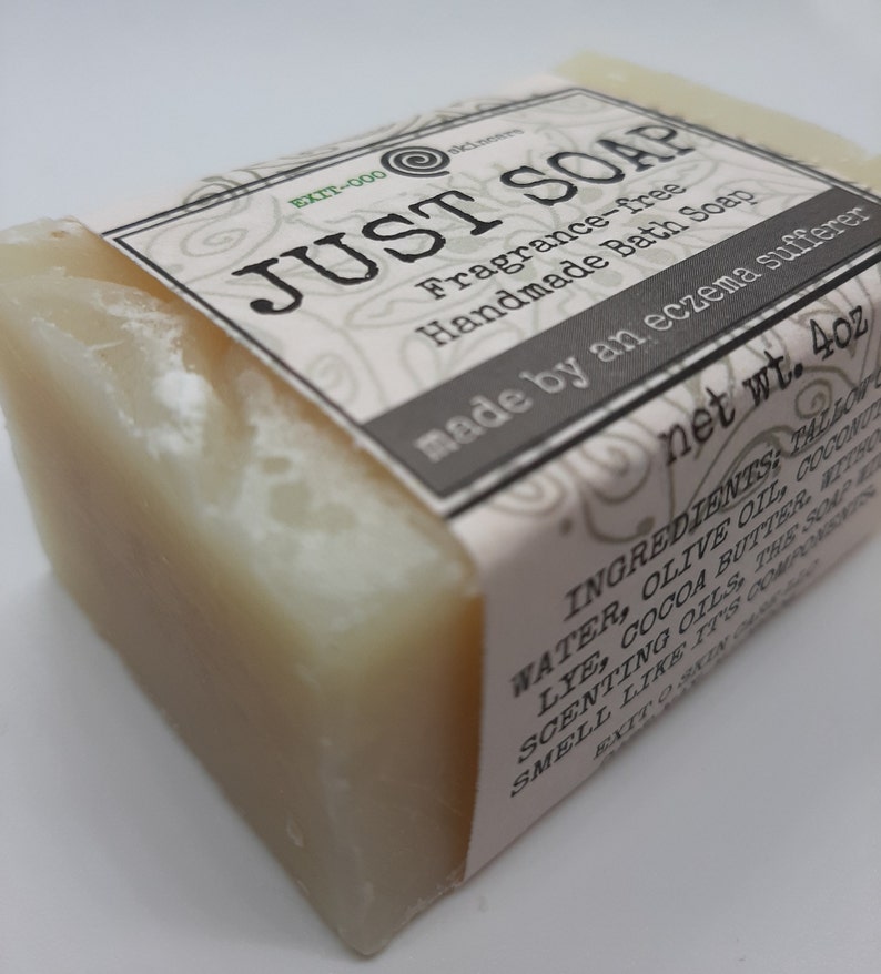 May include: A bar of handmade soap with a label that reads "JUST SOAP". The label also states the soap is fragrance-free and made for eczema sufferers. The net weight is 113 grams.