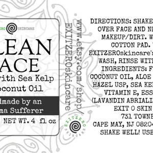 May include: A black and white label with the text "CLEAN FACE" in large, bold letters. The label also includes the text "Made with Sea Kelp & Coconut Oil" and "Handmade by an Eczema Sufferer". The label is for a 4 fl oz bottle of face wash.