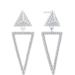 May include: A pair of silver dangle earrings with a geometric design. Each earring features a small pyramid-shaped top with a larger triangle pendant hanging below. Both the pyramid and triangle are covered in small, clear stones.