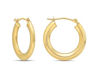 May include: A pair of polished 14k yellow gold hoop earrings with a smooth, rounded tube design. The earrings feature a secure hinged post closure mechanism, showcasing a classic circular shape with a high-shine reflective metallic finish.