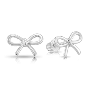 May include: A pair of silver bow-shaped stud earrings.