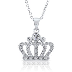 May include: A silver-toned necklace featuring a crown-shaped pendant. The pendant is encrusted with numerous small, clear, sparkling stones and is topped with three larger, round, clear stones set in a vertical arrangement along the top edge.