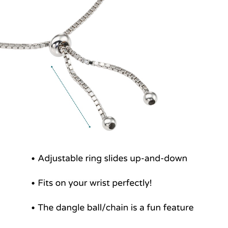May include: A silver chain bracelet with an adjustable ring and a dangling ball charm. The ring slides up and down the chain to adjust the bracelet's size.